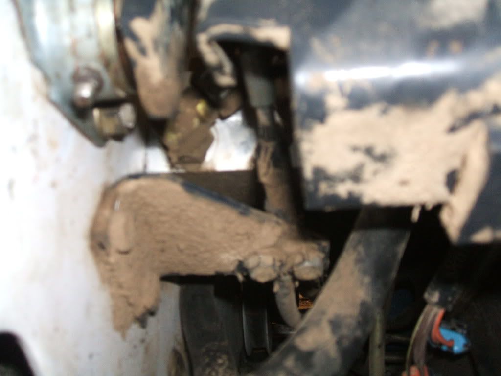 The cable is routed around the control valve and is a attached to a pivot #21/#22 that operates the spool.